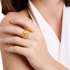 Embrell Becoming Empress Ring in 22K gold-plated finish, handcrafted molten textured statement ring with layered design, demi-fine jewellery worn by a woman for a bold elegant look.