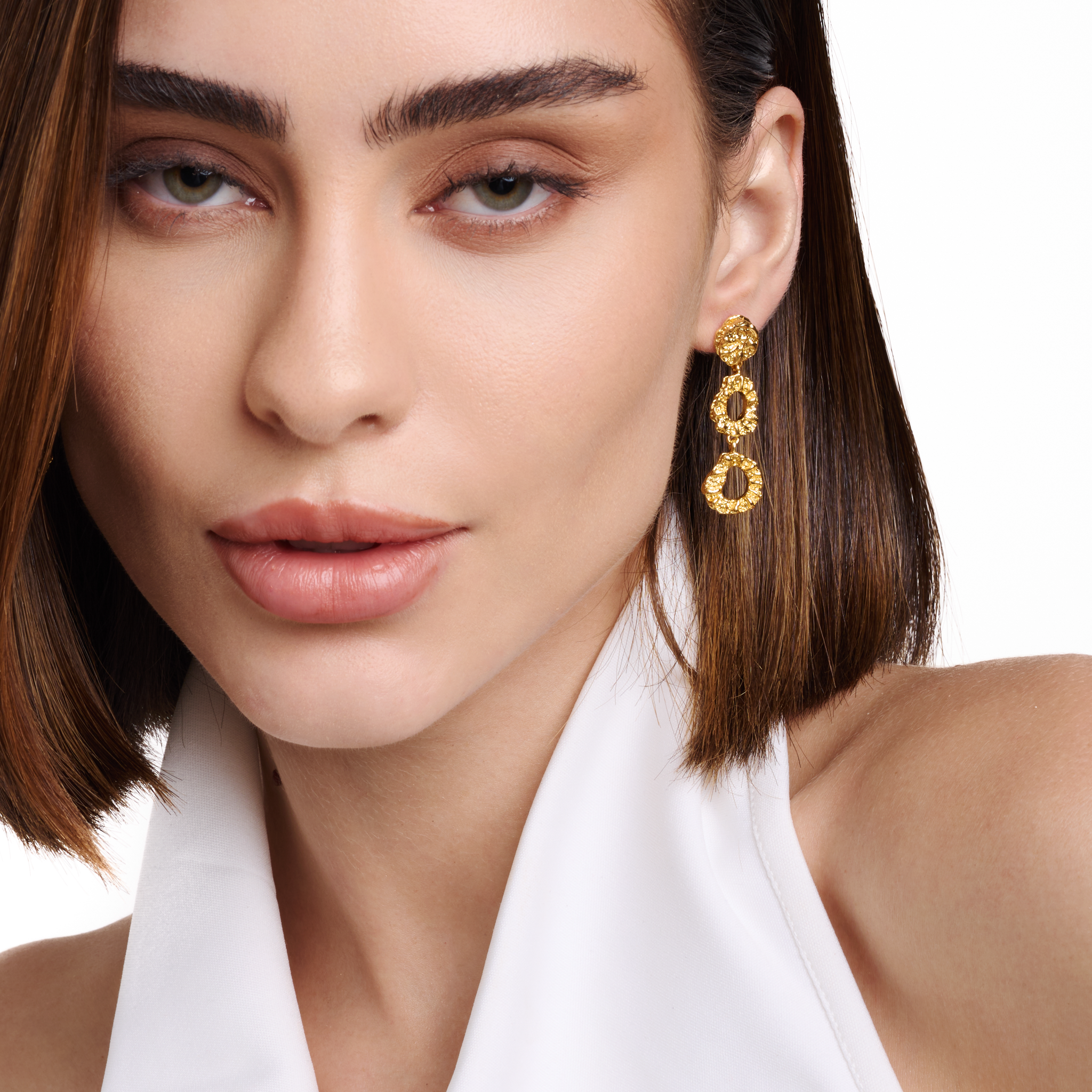 Embrell Becoming Evolve Earrings in 22K gold-plated finish, handcrafted molten textured triple drop earrings, demi-fine jewellery worn by a woman for a bold elegant look.