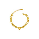 Gold chain bracelet with a heart-shaped clasp on a white background