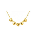 Gold heart-shaped necklace on a white background