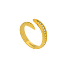 Gold open ring with embedded stones on a white background