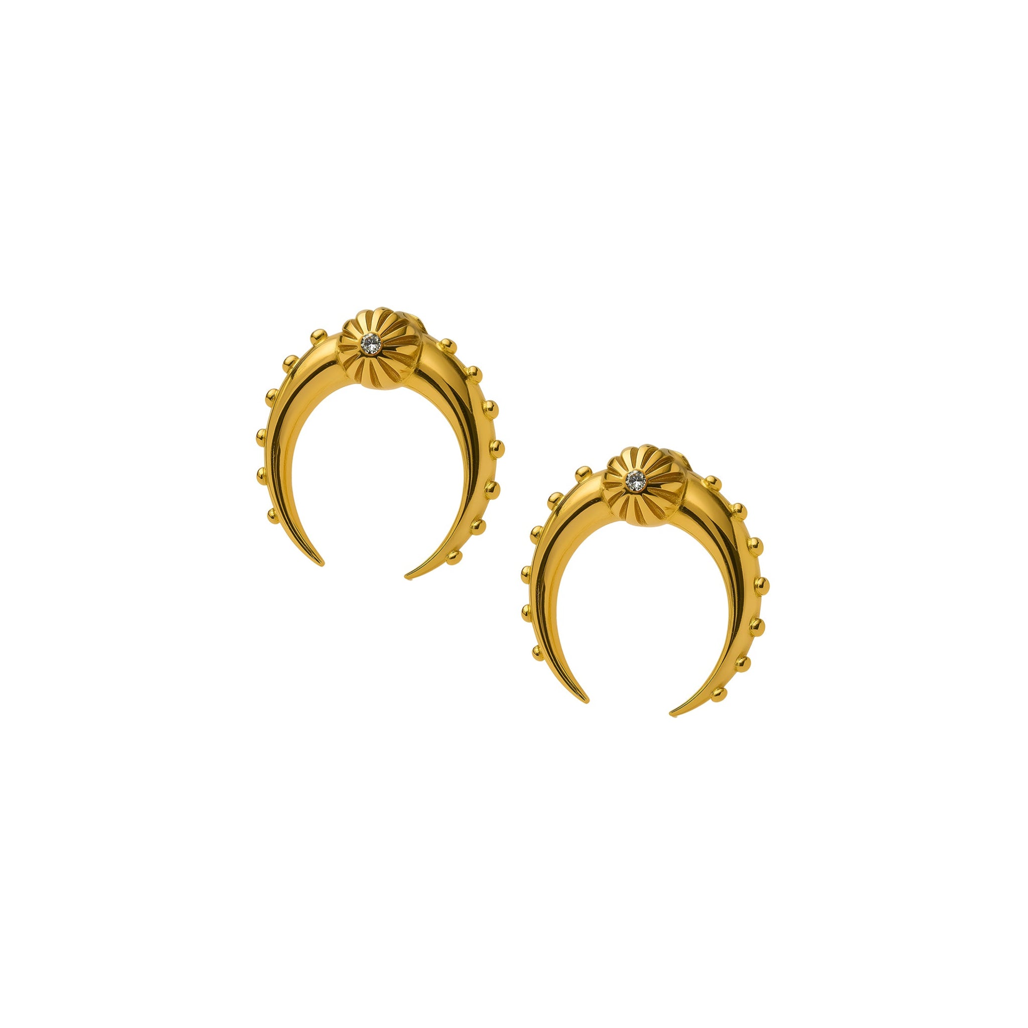 Gold crescent-shaped earring with a central gemstone on a white background