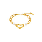 Gold bracelet with abstract-shape and pearls on a white background