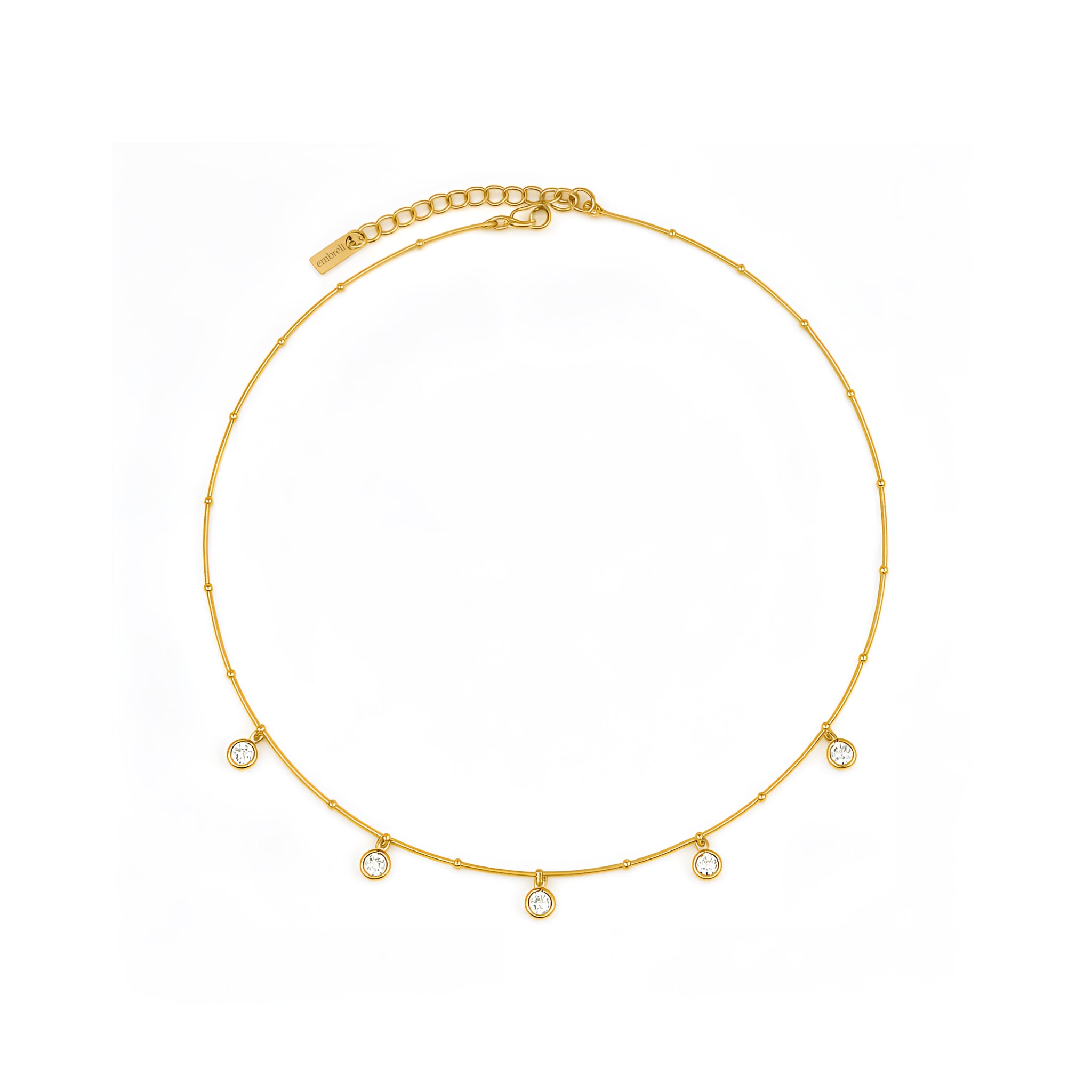 Gold necklace with small diamonds on a white background