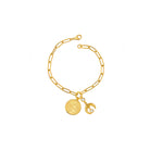 Gold bracelet with charms on a white background