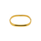Gold bangle on a white background