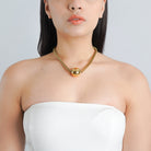 18K gold-plated mesh chain with a bold spherical pendant, adding a contemporary edge to your style.