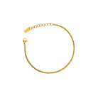 Gold bracelet on a white background