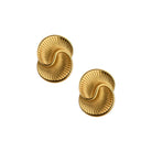 Pair of gold spiral earrings on a white background