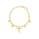 Gold bracelet with various charms on a white background