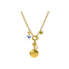 Gold necklace with shell and starfish charms on a white background