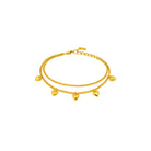 Gold bracelet with heart-shaped charms on a white background