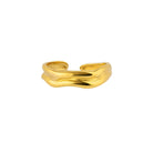 Gold ring with a wavy design on a white background