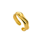 Gold ring with a wavy design on a white background