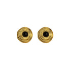 Pair of gold earrings with black centers on a white background