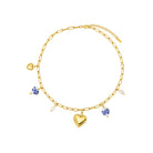 Gold Necklace with heart-shaped charm and small beads on a white background
