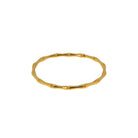 Gold bracelet on a white background