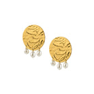 Gold earrings with pearl drops on a white background