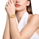 Embrell Becoming Origin Bracelet in 22K gold-plated finish, handcrafted molten textured circular motif with triple chain design, demi-fine jewellery worn by a woman for a bold elegant look.